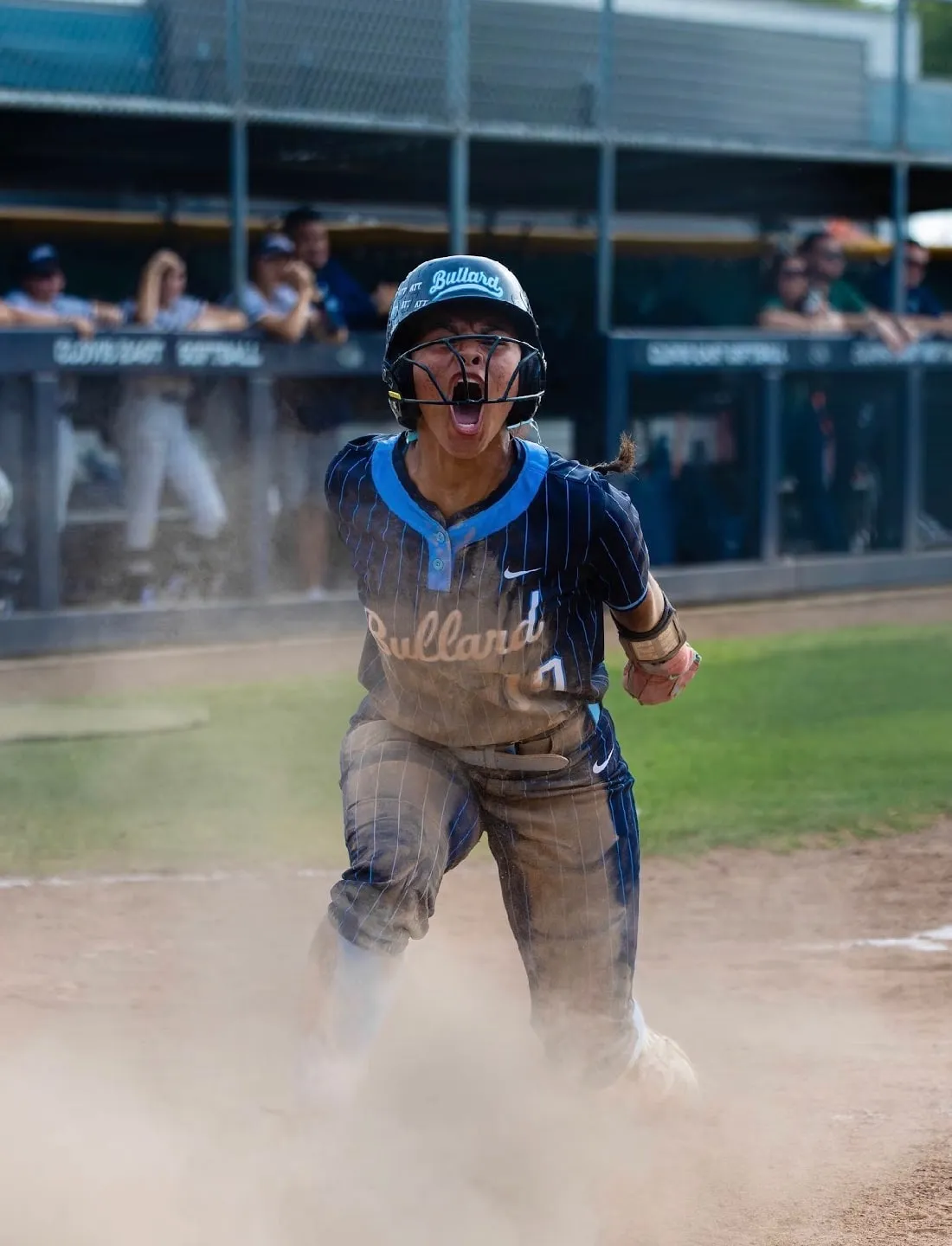 Bullard softball player celebrating at home plate